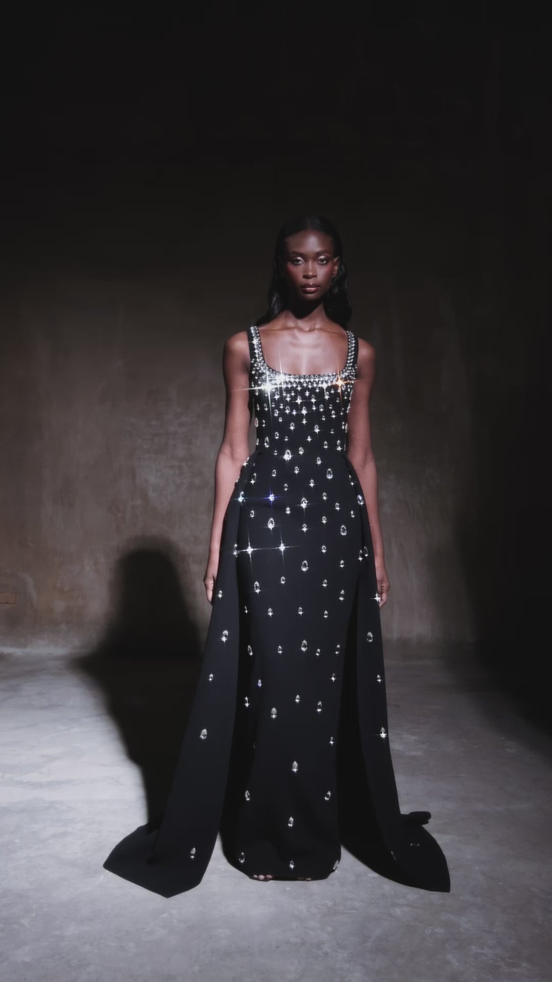 Fully embroidered black dress with overskirt.