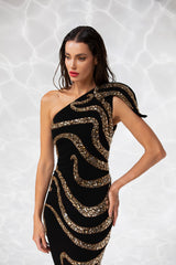 One shoulder black crêpe column gown, lavishly illustrated with an octopus embroidered in golden shadow crystals and beads