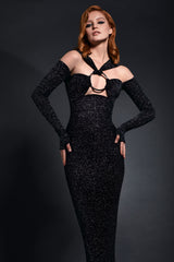 Black star-dust silhouette hugging dress with center front gunmetal harness ring and a cascading floor length train