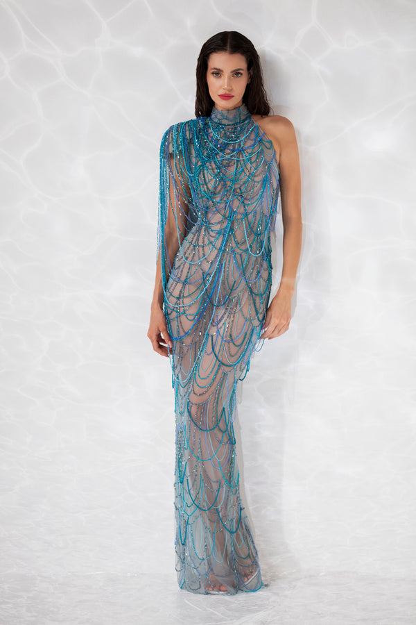 Sheer dress embroidered with waves of cyan, navy, turquoise, aqua, sky blue, and aquamarine crystal beads.