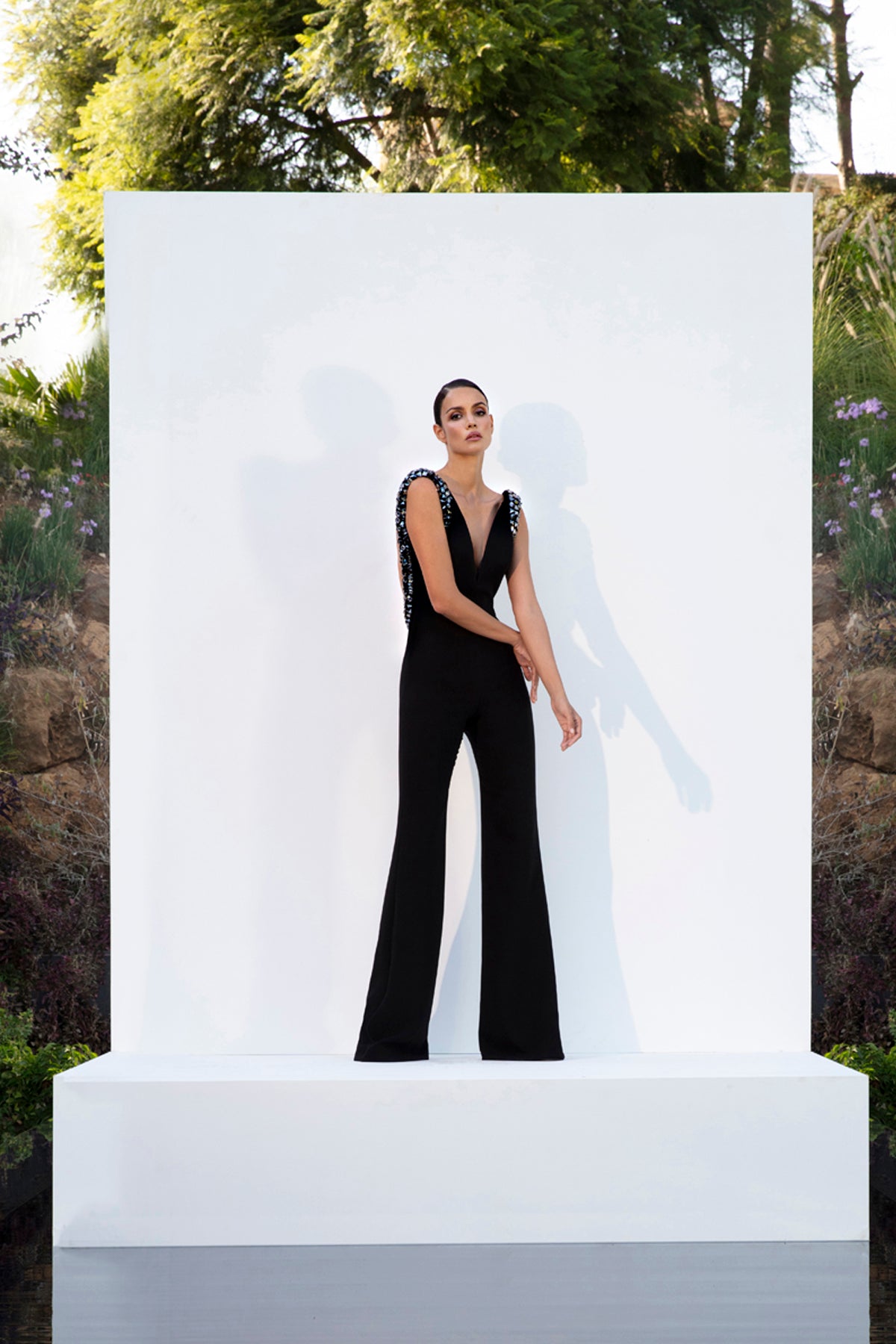 Black crêpe jumpsuit with plunging neckline