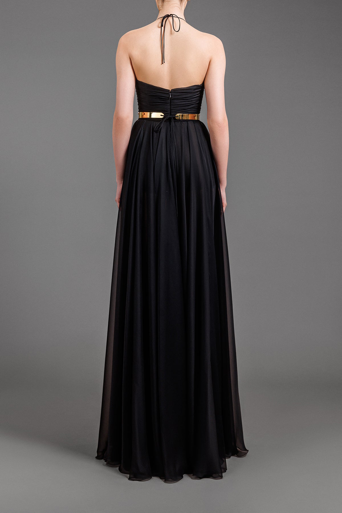 Metal gold structured belt on black chiffon dress  