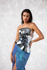 Strapless creation consisting of a corset in mirror plexiglass and a skirt in foiled tulle