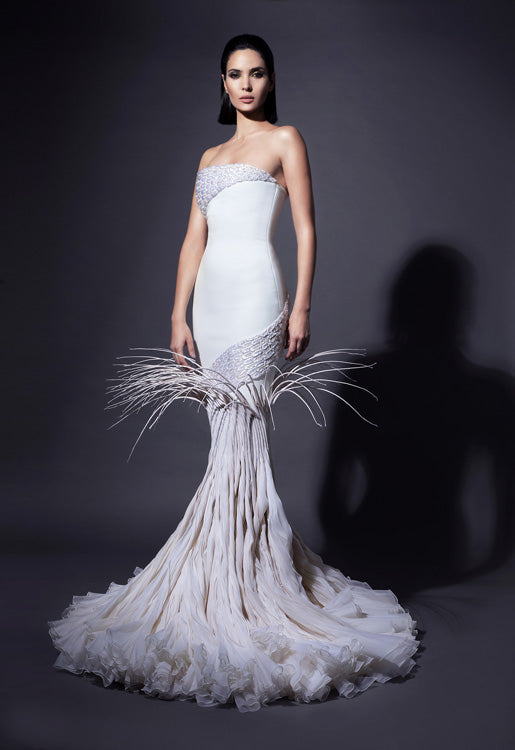 Strapless white silk crêpe gown with dramatic breakout mermaid tail in rippling silk organza, adorned with mermaid scales in 3D raffia threadwork, pearls, and crystals