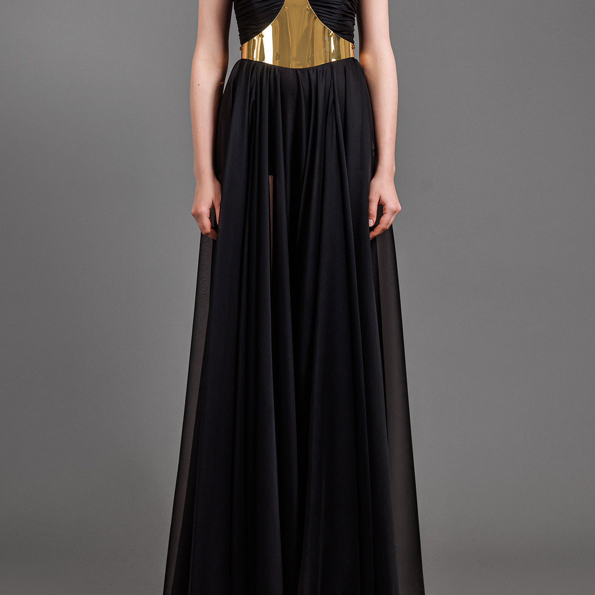 Black chiffon dress with a metal gold structured belt