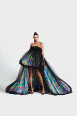 Strapless puffball gown in black tulle and rainbow reflective taffeta with a black velvet corset embellished with coq plumes