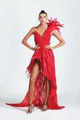 Asymmetric dress in silk organza with an exploded shoulder and skirt volume, hand appliquéd with fiery red plumes and embroidered with Swarovski crystals