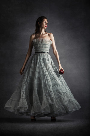 Silver tulle strapless draped A-line tiered gown with belt