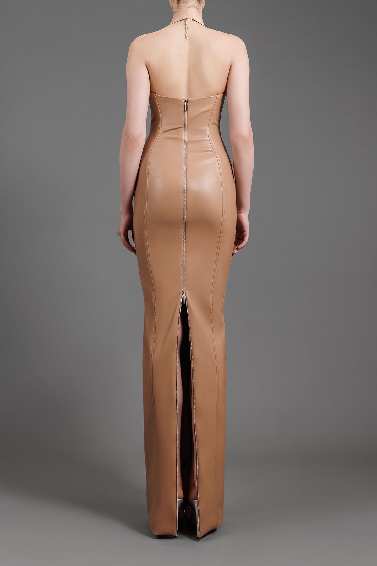 Fitted nude leather dress with metal detailing on bust