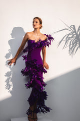 Asymmetrical purple dress with layered feathers