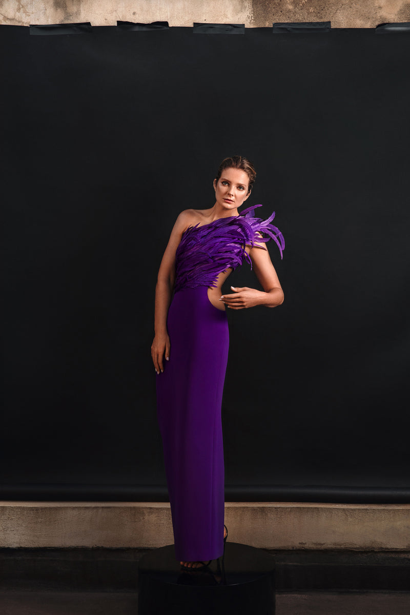 One-shouldered purple crêpe dress with feathers and waist cutout