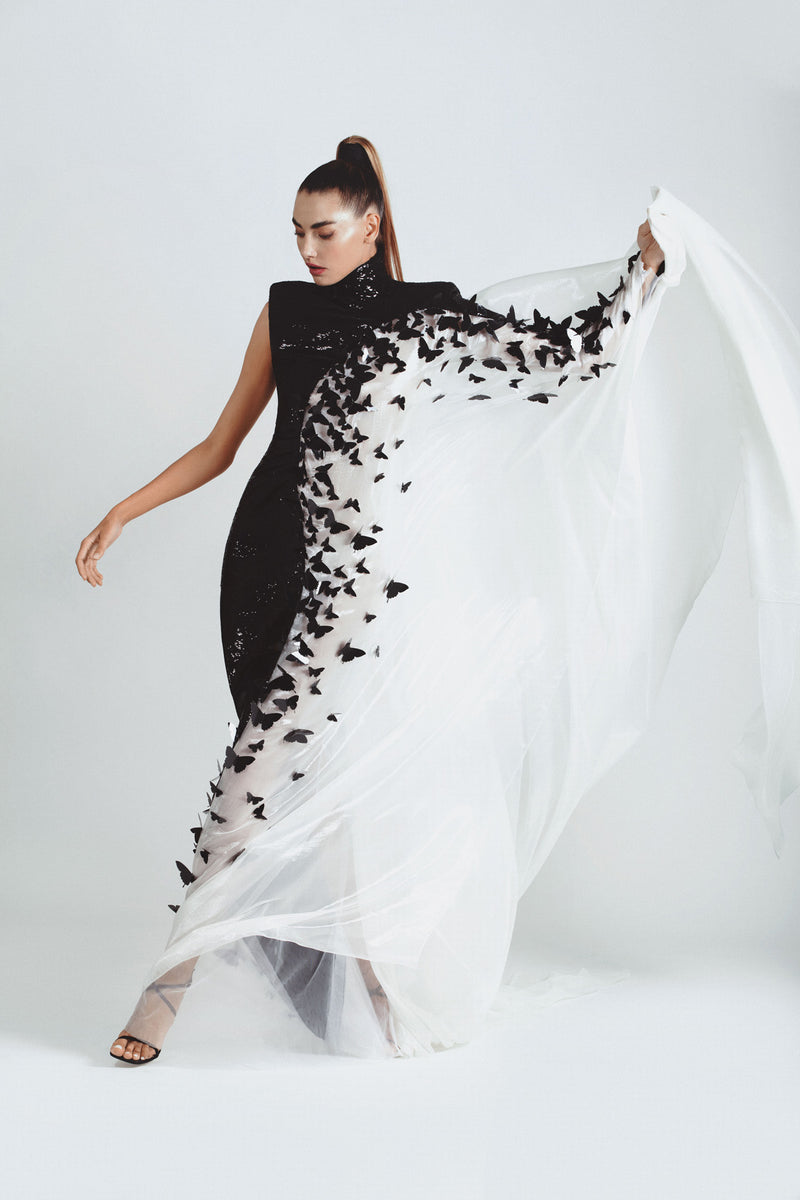 Asymmetric dress in jet black sequins and white liquid chiffon embellished with 3D laser-cut butterflies
