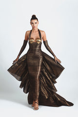 Draped slinky gown with an exploded bow-back ruffle in bronze foiled silk tulle featuring scallop shells handcrafted from solid brass and finished with hand-applied antique gold