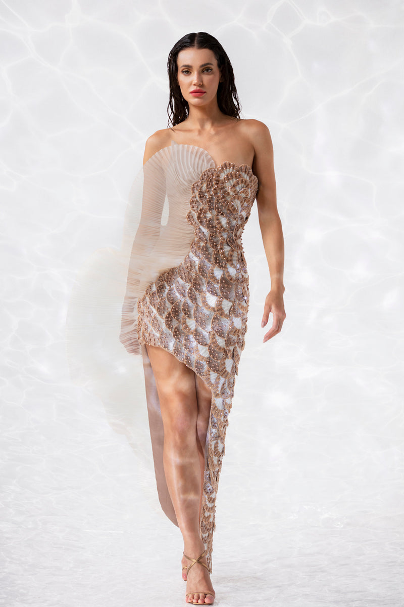 Asymmetric dress covered with scallop shells embroidered in silk threads, crystals, and micro-beads, finished with a ruffle in pleated silk organza