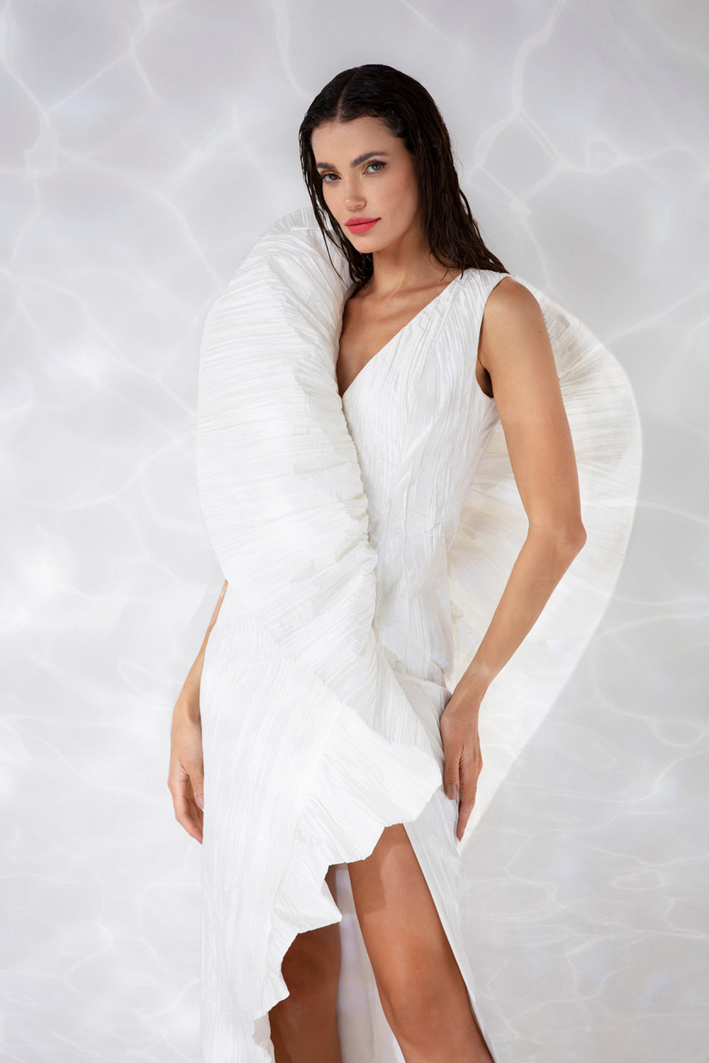 White crushed silk taffeta dress with a side split and exploded ruffle