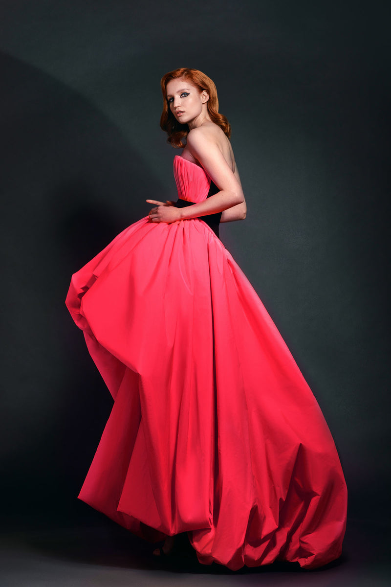 Plunging neon pink puffball gown with black belt