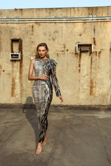 Snakeskin dress covered in sparkly sequins and embellished with hand-painted plumes metamorphosing into a bird