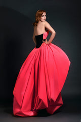 Strapless neon pink puffball gown with black belt