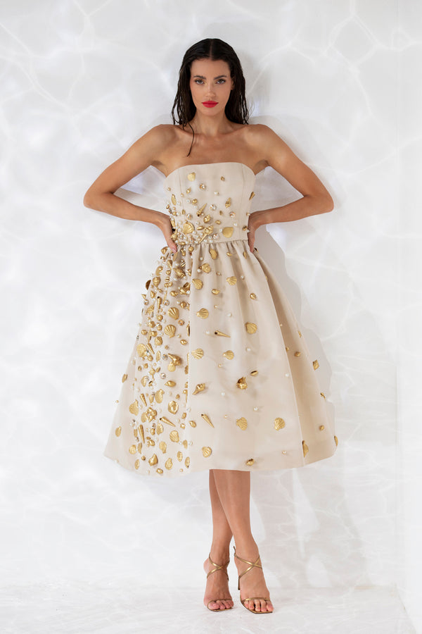 Strapless corseted sand color faille midi gown embroidered with pearls and hand painted shells