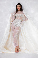 Round neck sheer white bodysuit with crystal and pearl embroidery, worn with an ivory white silk taffeta cape