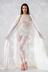 Sheer white bodysuit with crystal and pearl embroidery, worn with an ivory white silk taffeta cape