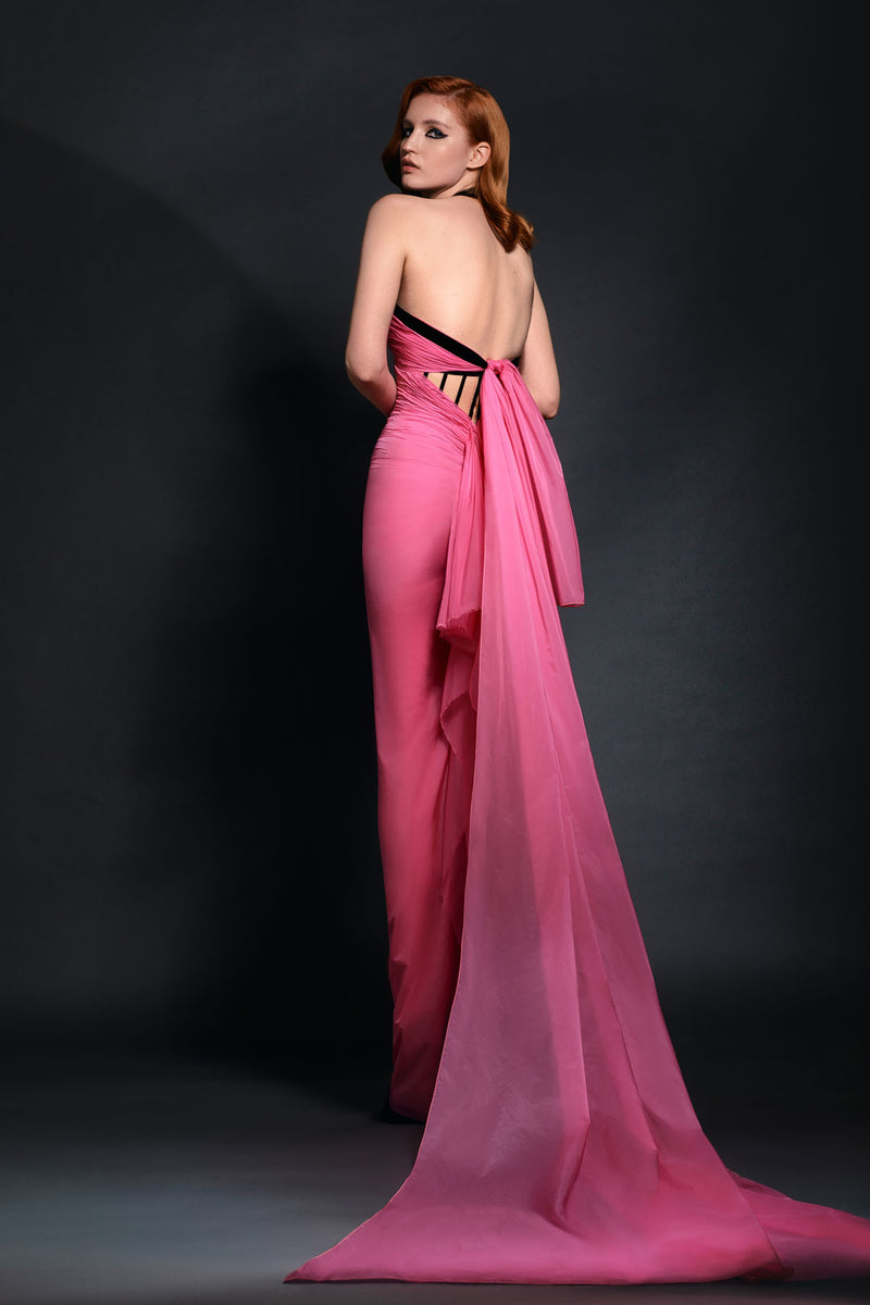Sweetheart neckline hot pink impermeable chiffon and black velvet corseted draped dress with ruffled back bow detailing