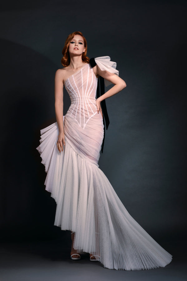 Ivory asymmetrical pleated tulle gown with black velvet bow detailing
