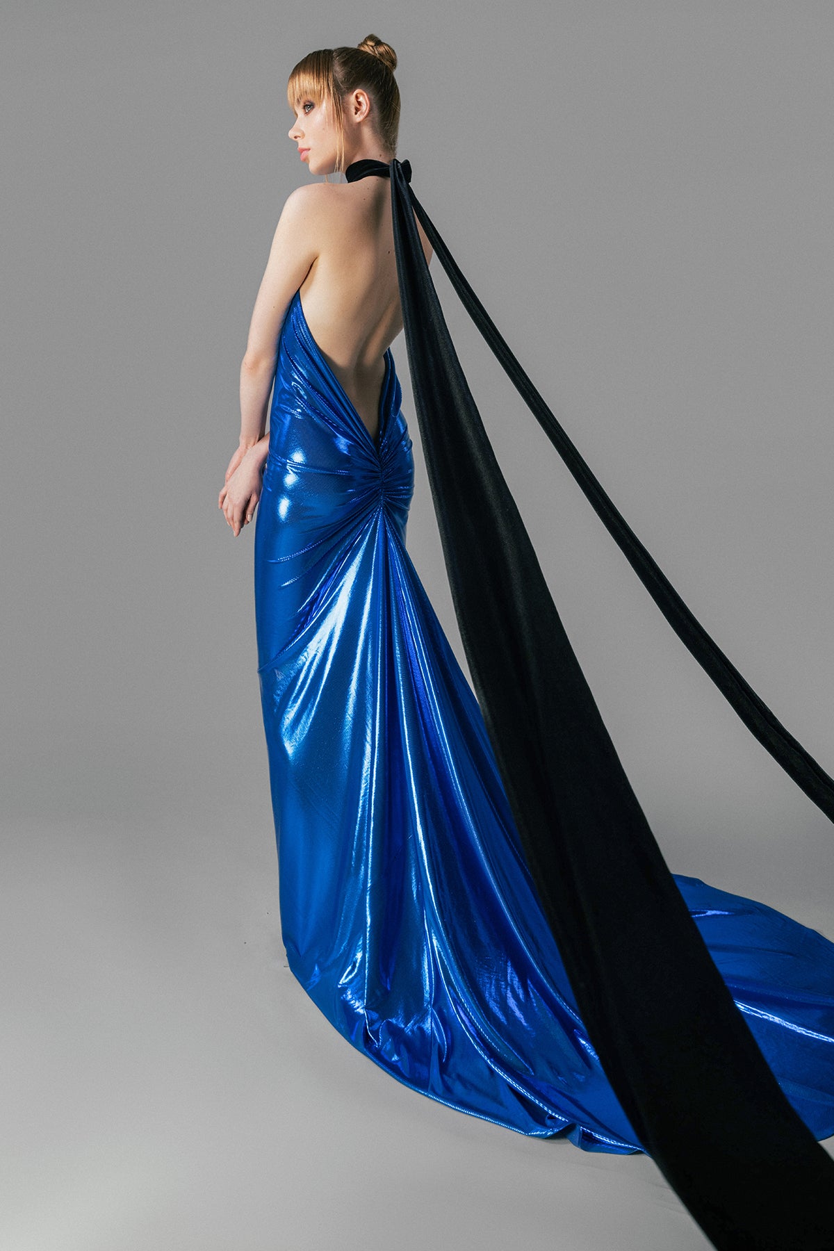 Blue lamé dress with black velvet tie