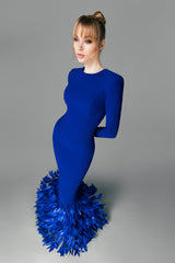 Blue crêpe dress with layered feathers on the hem