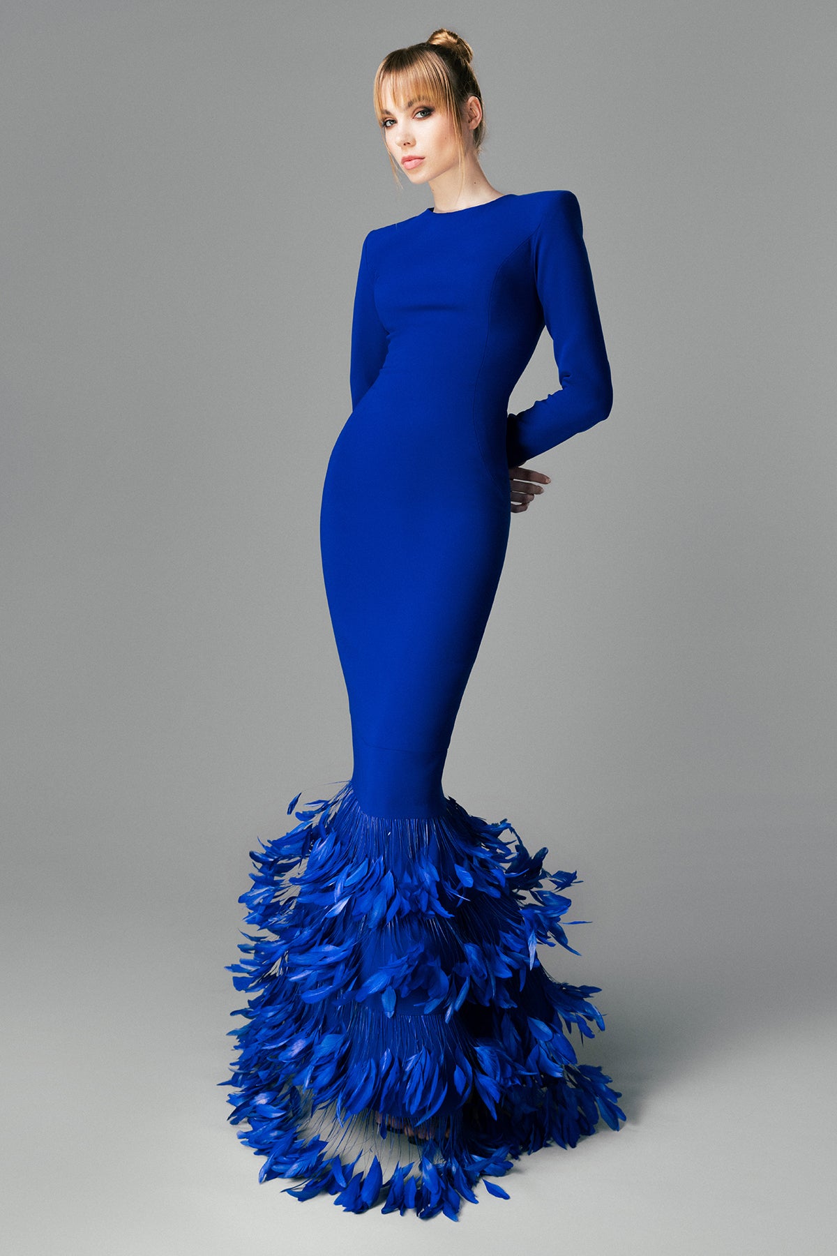 Royal blue crêpe dress with layered feathers on the hem