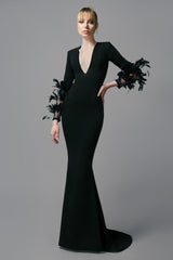 Black crêpe dress with feathers on the sleeves