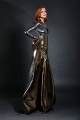 Asymmetrical gunmetal lamé one shoulder bustier accompanied by a pleated gold lamé skirt with floor length bustle