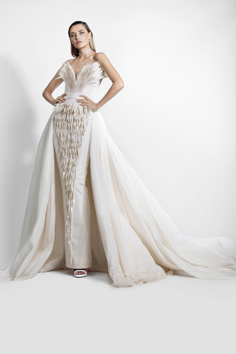 Ivory silk taffeta gown with layered 3D handcrafted plumes and a dramatic overskirt