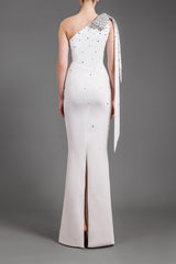 Bow detail embroidered with black crystals on one-shoulder white crêpe dress , back side