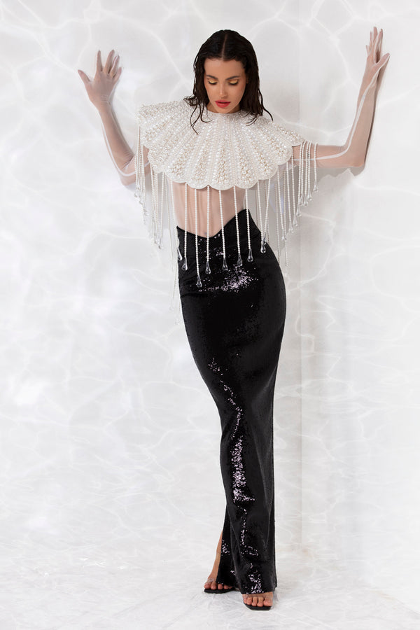 Pearls, crystals, and hand blown glass drops embroidered scallop shell inspired ensemble consisting of a cropped top, worn with a white sheer bodysuit and a pencil skirt in high gloss sequins