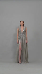 Silver dress with chains, plunging neckline and structured shoulders