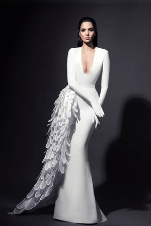 White silk crêpe dress with built-in gloves and dramatic overskirt overflowing with layered 3D handcrafted plumes in crêpe and crin