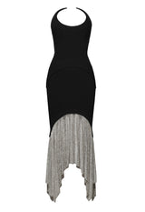 Black crêpe dress with crystal chainmail v-skirt and a pointed neckline 