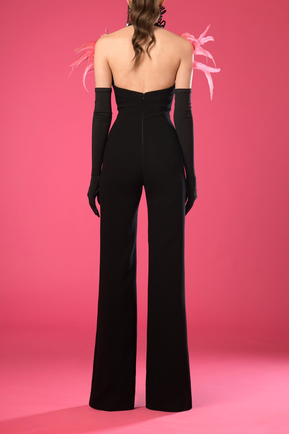 Black crêpe jumpsuit with pink feathers and gloves