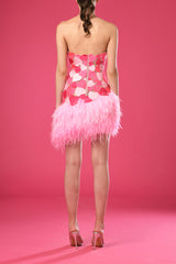 Asymmetrical pink mini dress with embroidered hearts and feathers