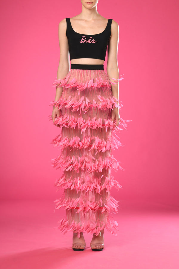 Black top with pink feathers skirt
