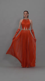 Orange red dress with cutouts, gloves and chains