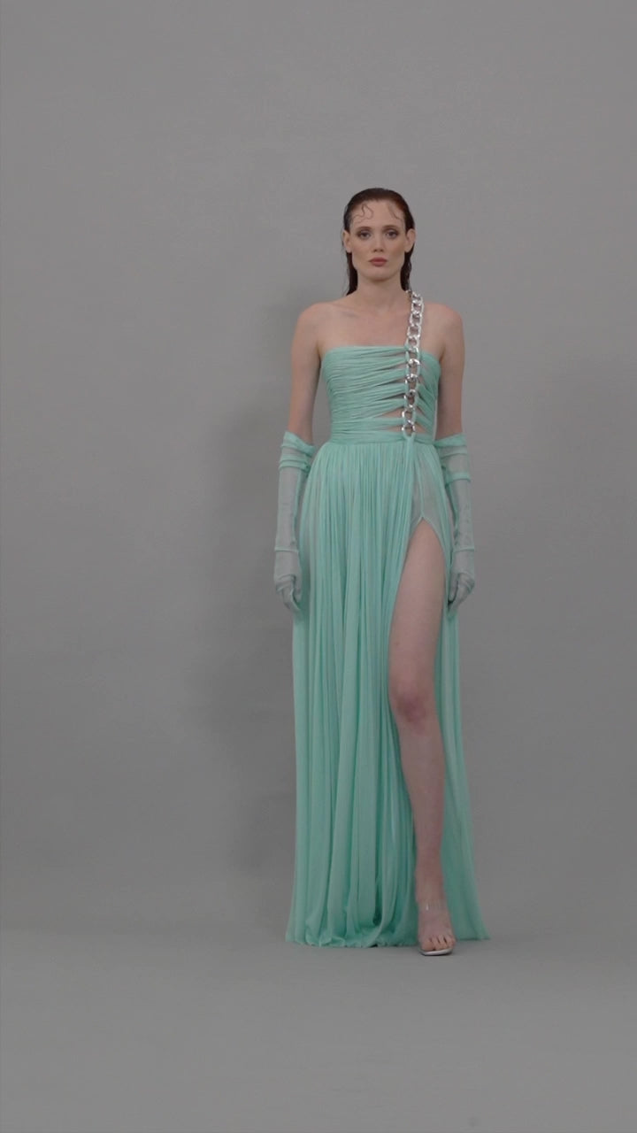 Asymmetrical aqua blue dress with chains and sheer gloves