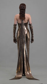 Bronze lamé dress with chains, gloves and floor sweeping halter neck tie