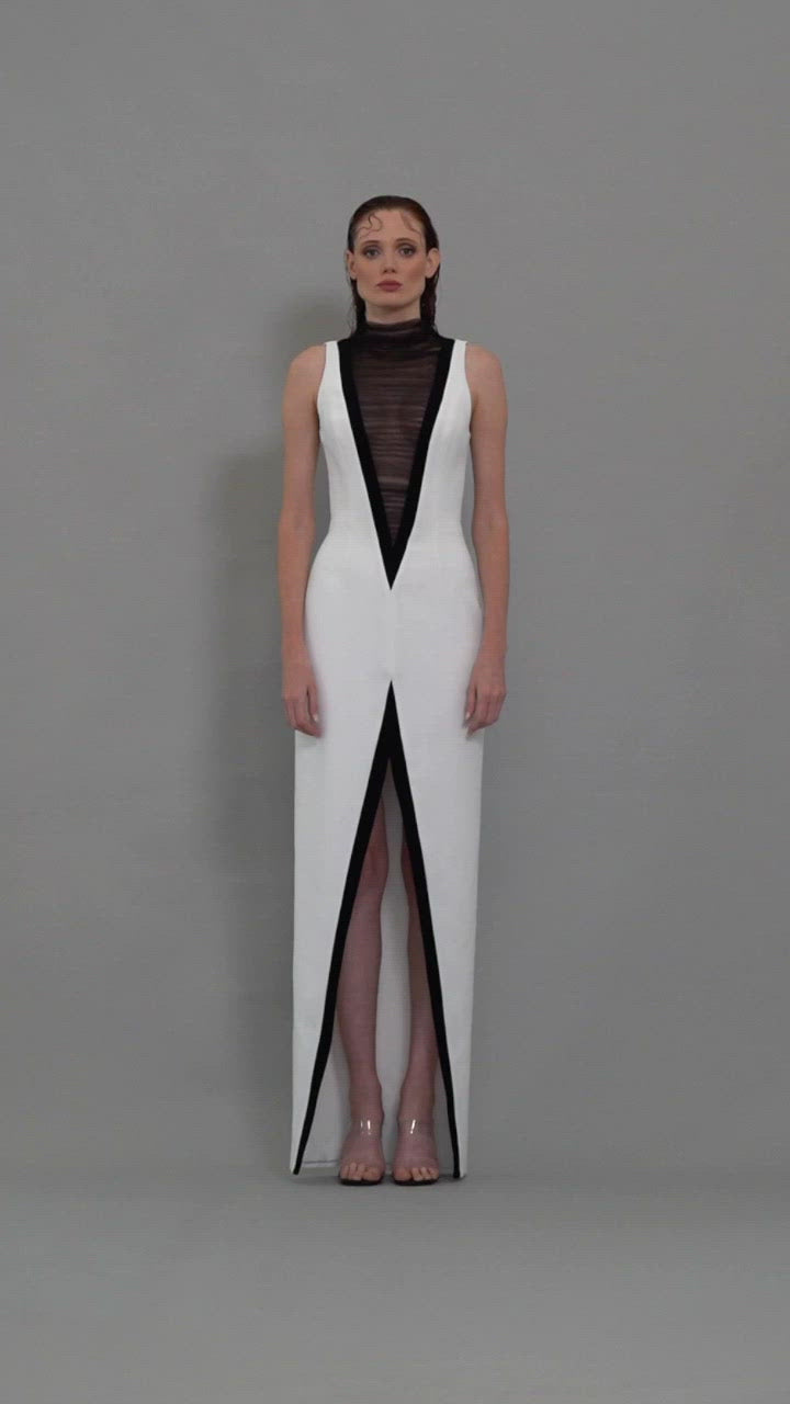 White crêpe dress with exaggerated plunging V neckline in tulle