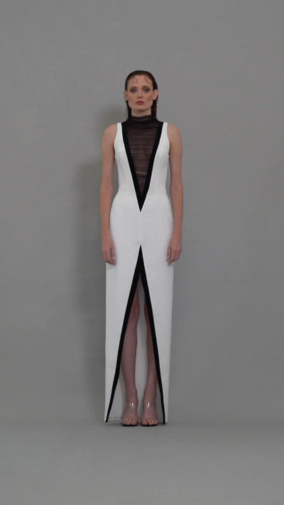 White crêpe dress with exaggerated plunging V neckline in tulle